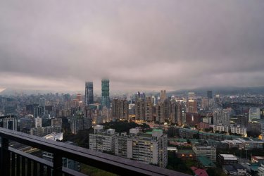 Cityscape of Taipei viewed from a high balcony during an overcast dusk