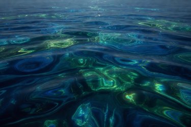 Deep rippling blue and green waters creating abstract patterns